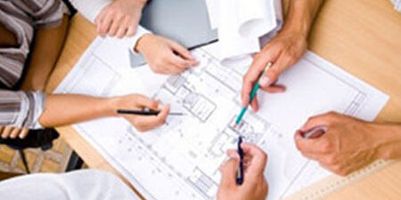 Team reviewing blueprint
